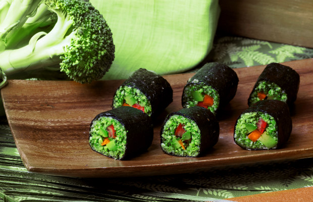 raw food rolls of buckwheat, broccoli, cucumber and pepper in a still life